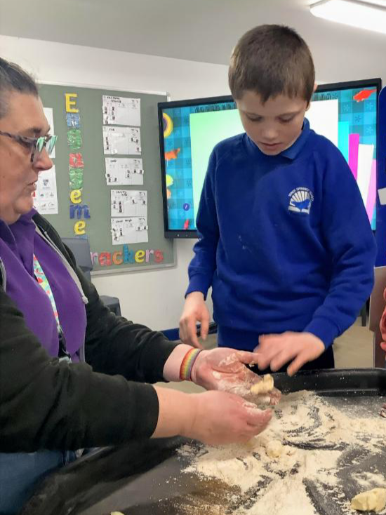 Teacher helping a male student