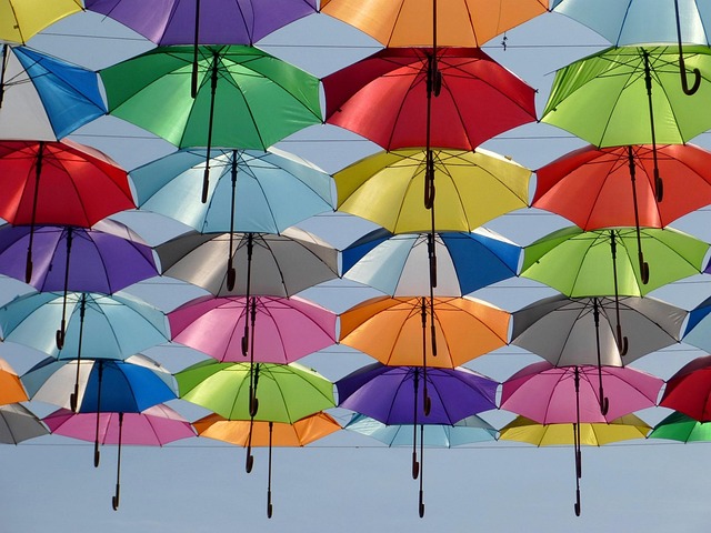 mulit-coloured umbrellas against the sky